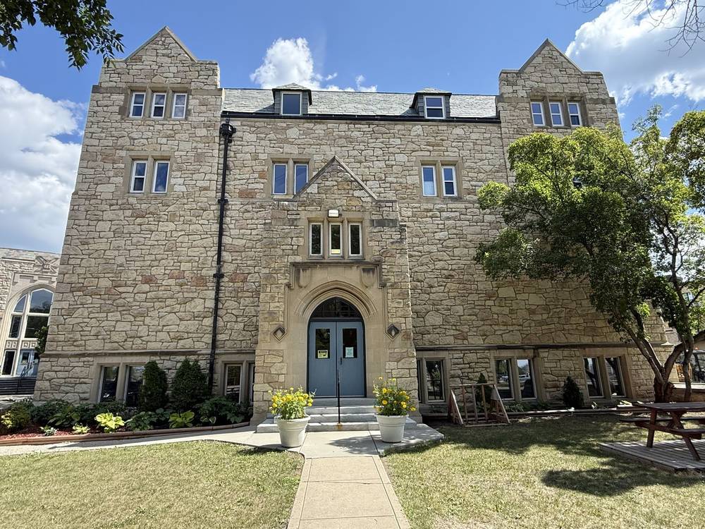 The stone entrance of the St. Andrew's Building on College Drive, where Studio 12 East is located